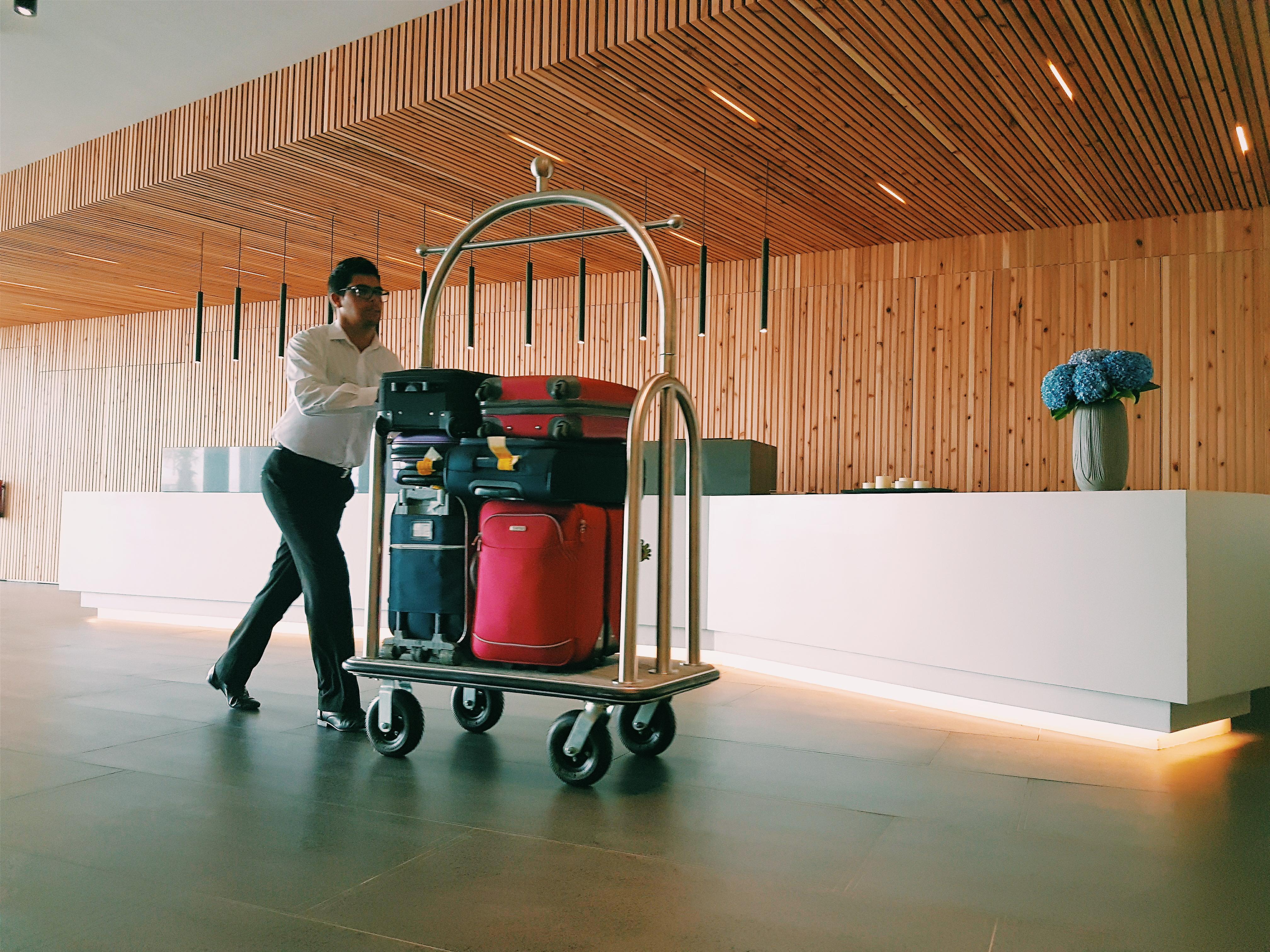 Pedras Do Mar Resort & Spa Fenais da Luz Exterior photo A bellboy pushing a luggage cart