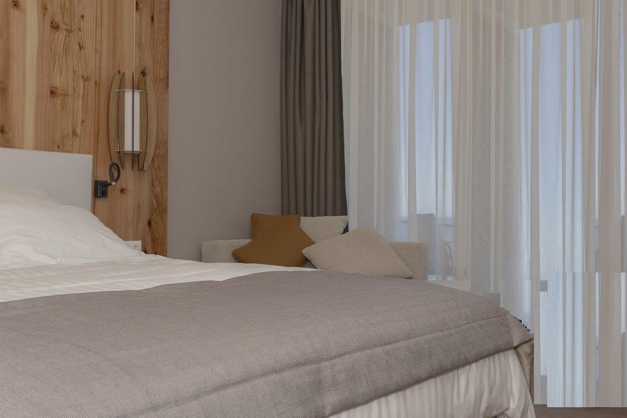 Pedras Do Mar Resort & Spa Fenais da Luz Exterior photo A bedroom with a bed and a sofa