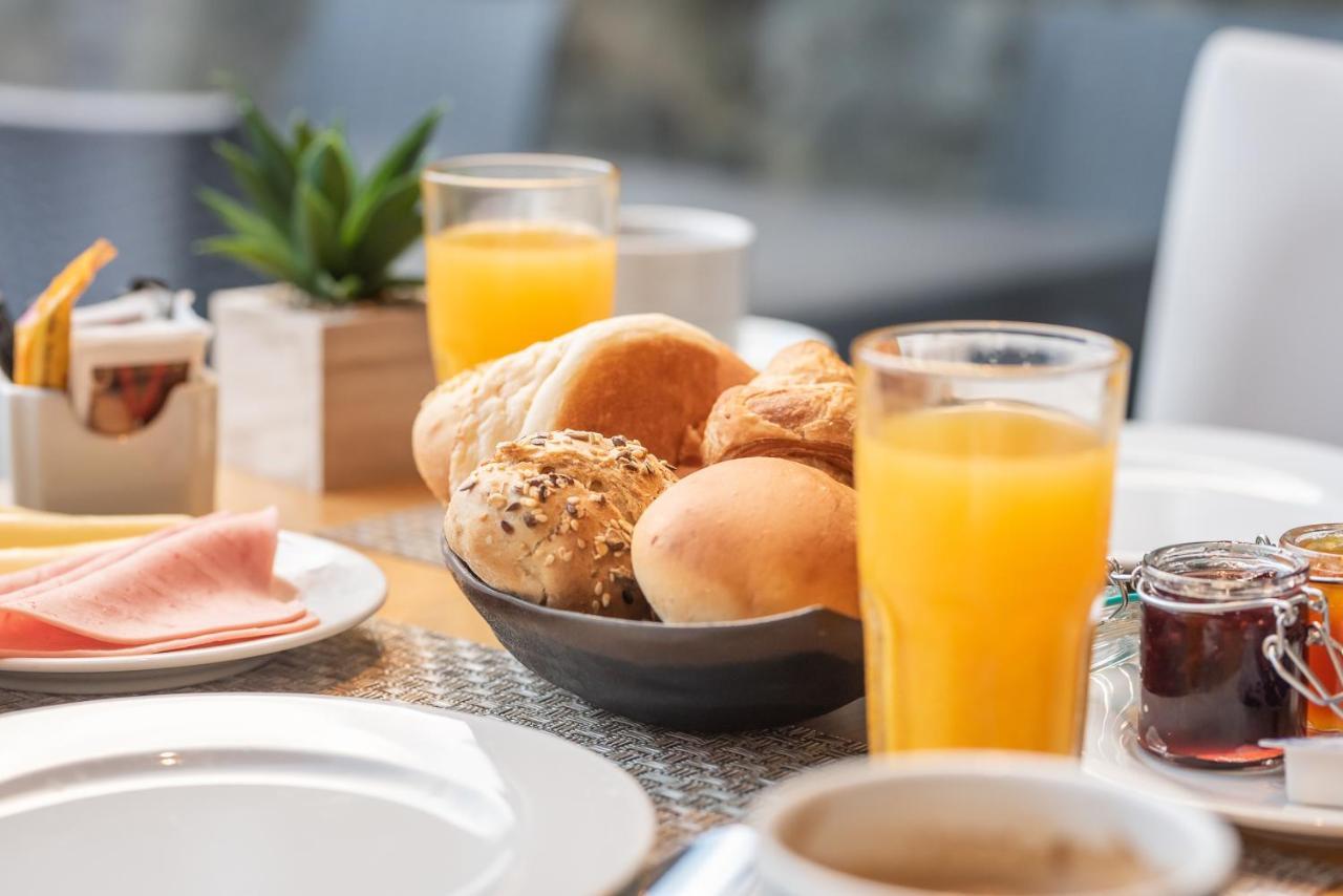 Pedras Do Mar Resort & Spa Fenais da Luz Exterior photo A continental breakfast